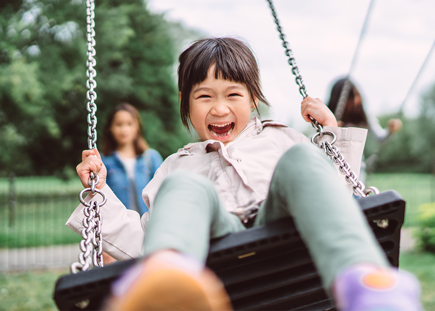 Young girl on swing